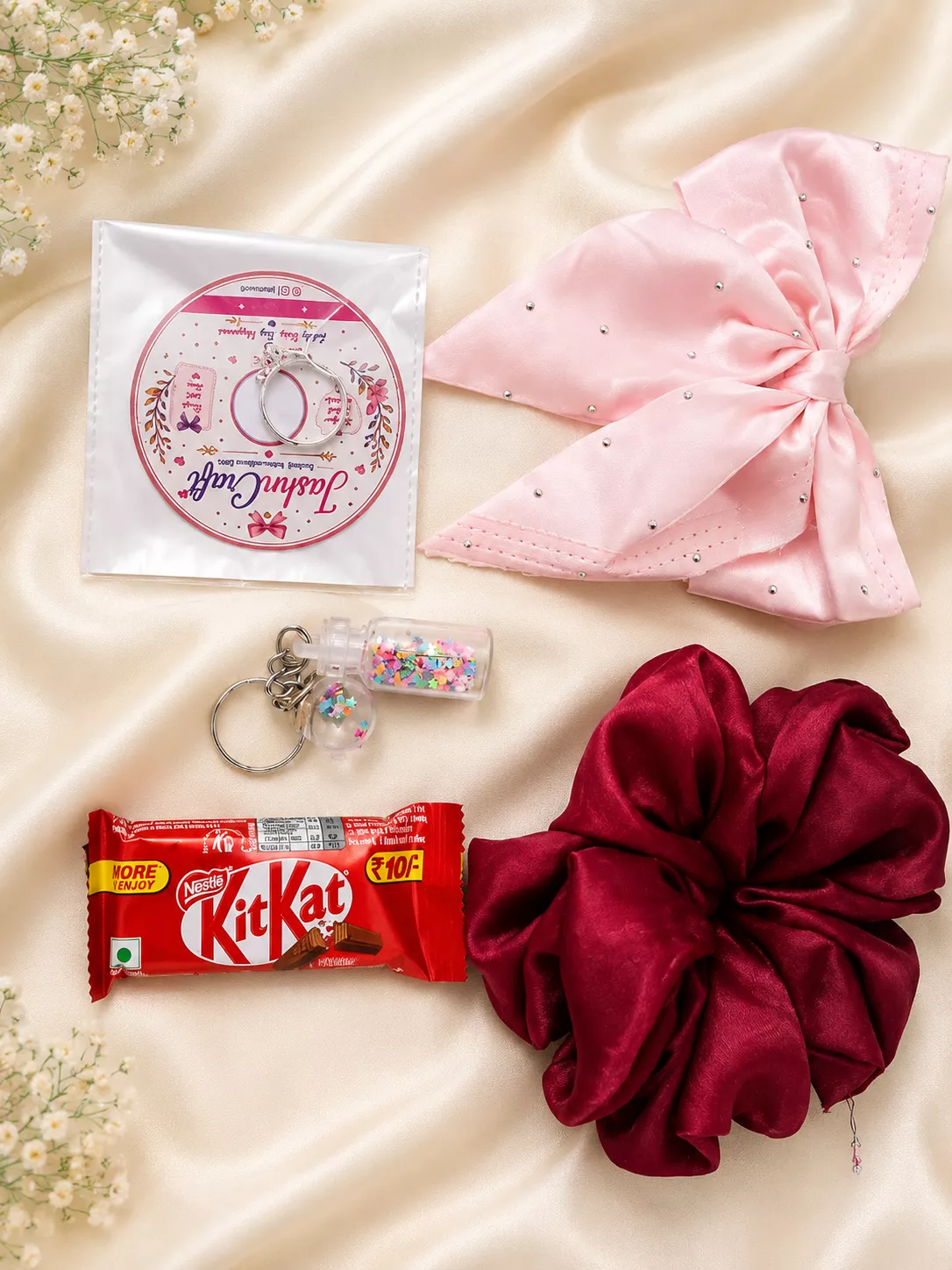 JashnCraft chocolate and accessories gift hamper for girls with pink bow, satin scrunchie and KitKat